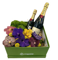 Cuarzo-caja verde con orquídeas vanda y bebidas Moet & Chandon Brut