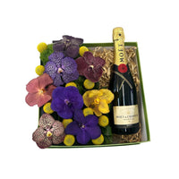Cuarzo-caja verde con orquídeas vanda y bebida  Moet & Chandon Brut