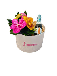 Delice-caja redonda blanca con orquídeas vanda y bebida