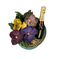 Topacio-caja redonda menta con orquídeas vanda y bebida