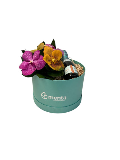 Delice-caja redonda menta con orquídeas vanda y bebida