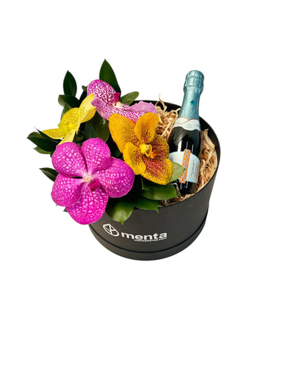 Delice-caja redonda negra con orquídeas vanda y bebida